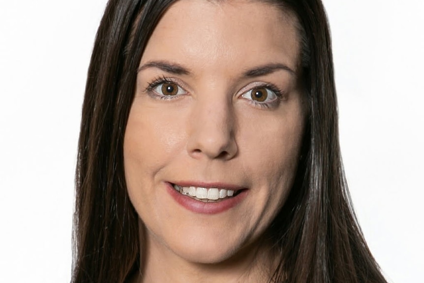 Headshot of a woman on a white background.